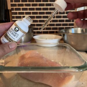 Photo of the Kitchen Gourmet: Garlic being used to marinate a chicken.