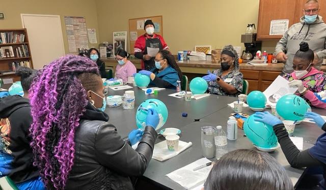 Locally known Barber teaches nursers how to shave heads.