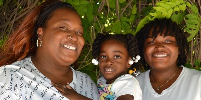 Local resident, Aisha, and her family in a group photo.